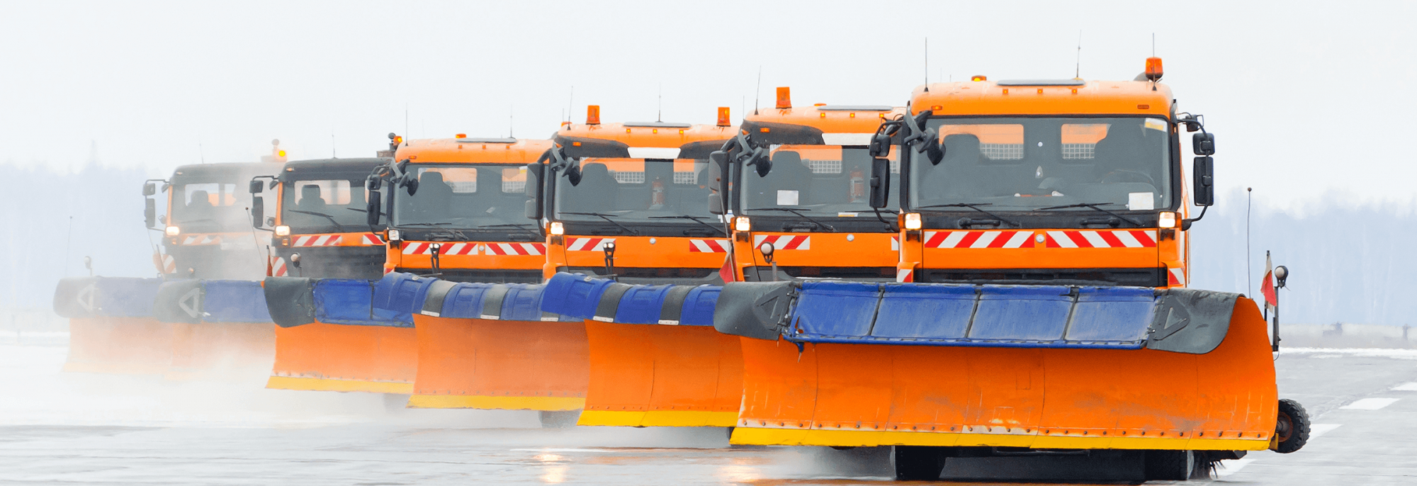 fleet of snowplow trucks